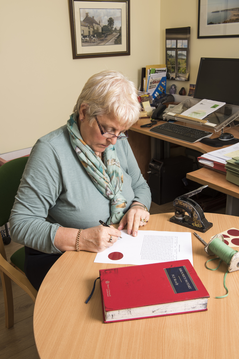 Jill Sinclair working on notarial documents